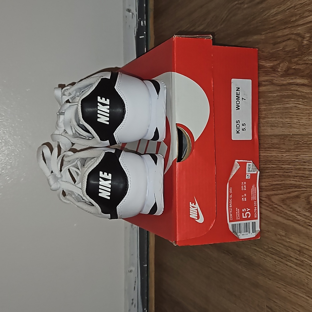 Brand new Nike Cortez, never worn outside. White and black 5.5 kids/ 7 women